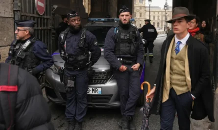 In a scene that confused many people on social media, a sharply-dressed man walked near police officers blocking an entrance at the Louvre on Sunday.