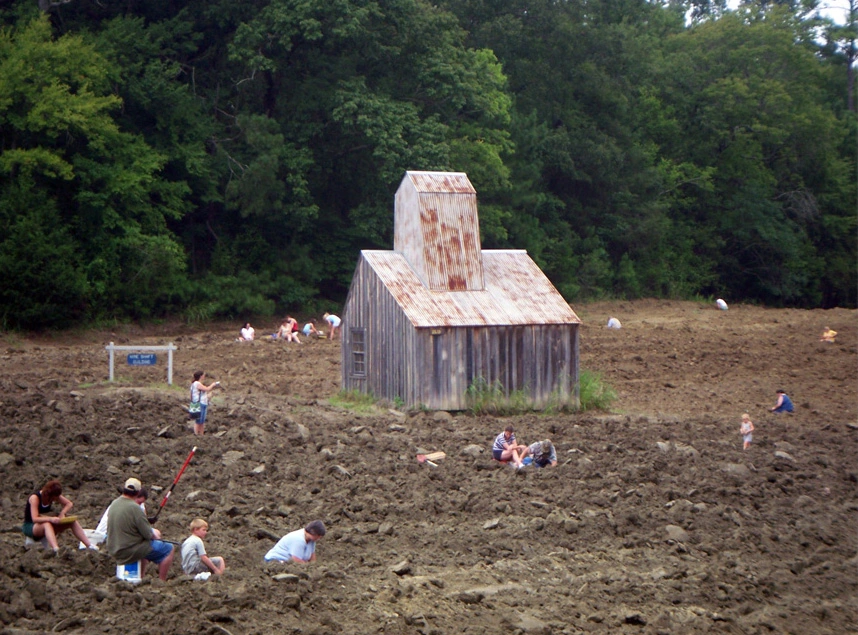 Visitors searching for diamonds in the plowed field at Crater of Diamonds State Park, Arkansas.