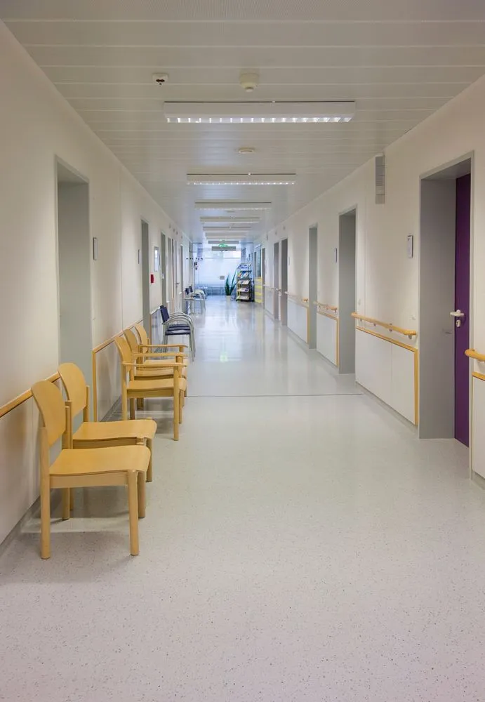 "empty hospital corridor and waiting area with clean lighting"
