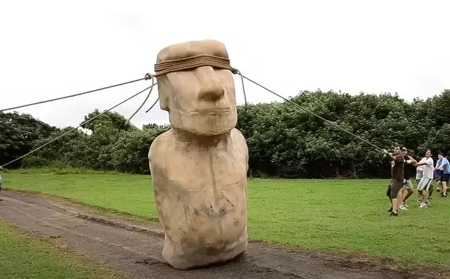 Researchers use ropes to make a replica Moai statue “walk” upright during an experiment on Easter Island’s ancient engineering techniques.