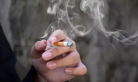 smoking two cigarettes.alt